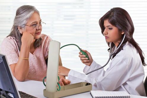 the doctor measures the blood pressure in hypertension